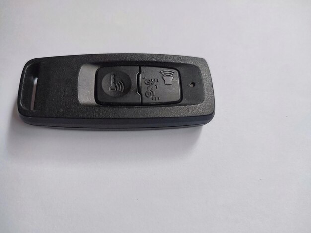 Motorcycle key with keychain isolated on white background