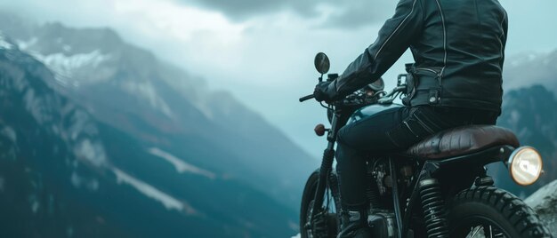 a motorcycle with a helmet on the front is in front of a mountain