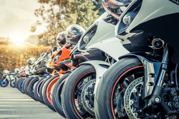 Motorcycles group parking on city street in summer