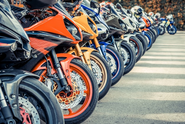 Motorcycles group parking on city street in summer