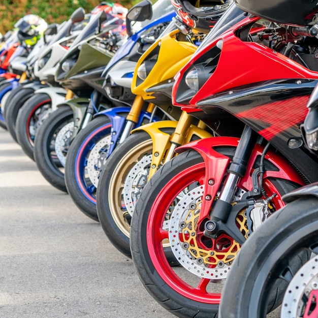 Motorcycles group parking on city street in summer