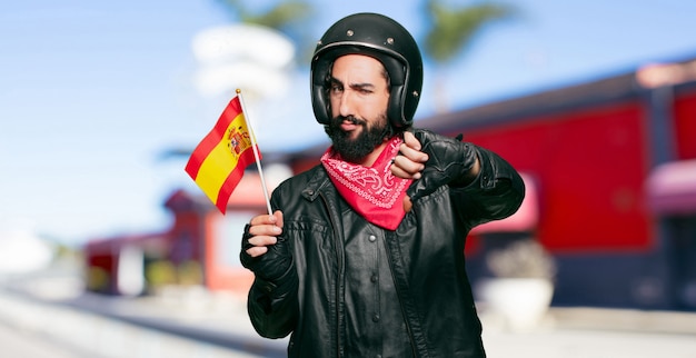 Motorrijder met een vlag van Spanje