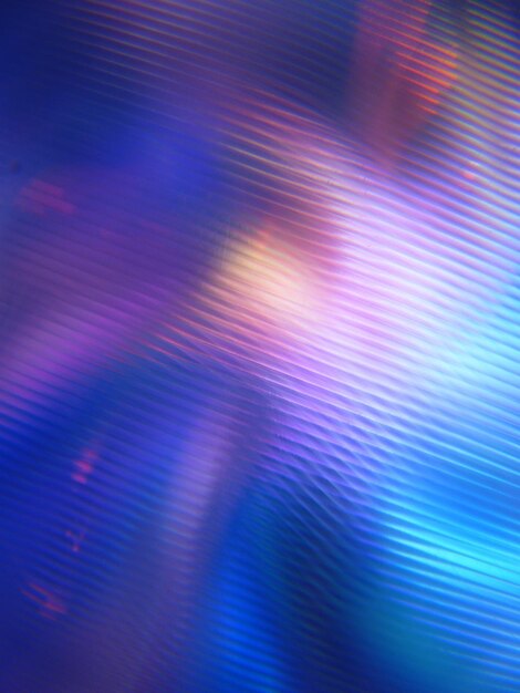 A mottled rotating abstract background with colorful light beams