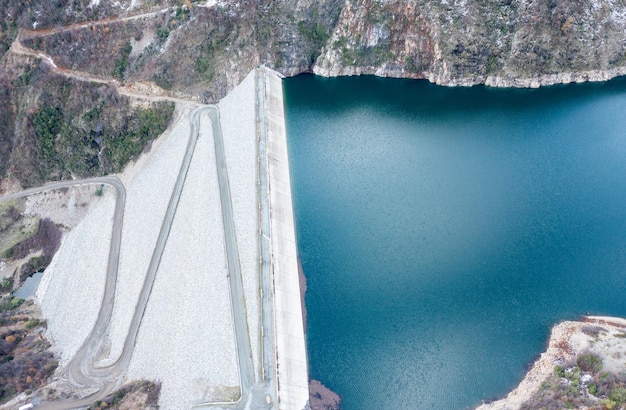 Mounains Lagoon Ancoa in the snow en region Maule Chile Aerial drone view