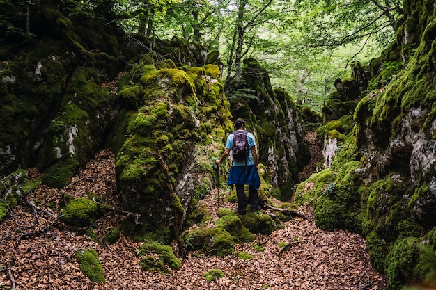 Mount Aizkorri, Guipuzcoa. A young man in a beautiful spot in the forest of Mount Aizkorri