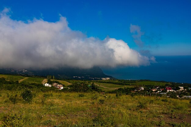 Mount Ayu Dag with clouds on the background of the Black Sea in the early morning.