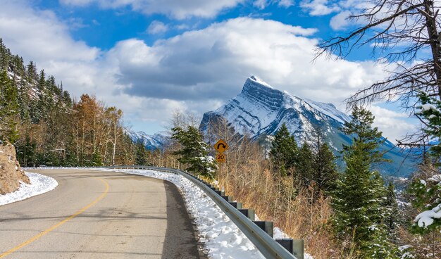 mount rundle snowy forest mountain road banff national park in winter canadian rockies canada