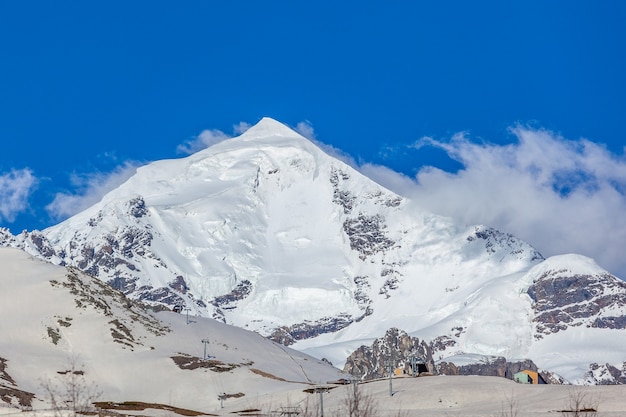 Mount Tetnuldi rises above the Great Caucasian Range in the upper Svaneti. Georgia. Travel