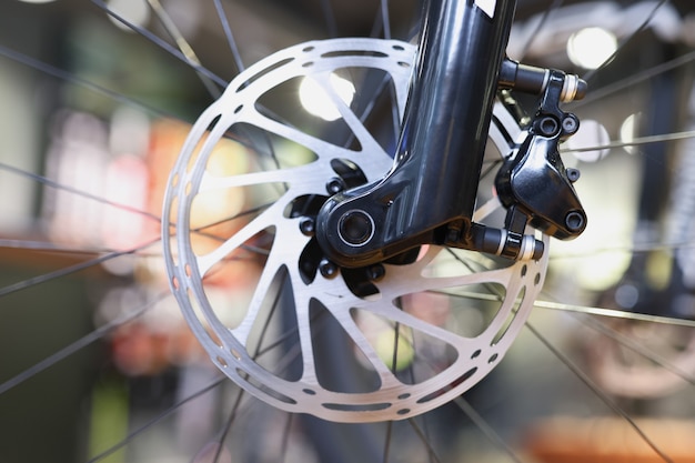 Photo mountain bike front wheel with mechanical disc brake part of brake of mountain bike concept