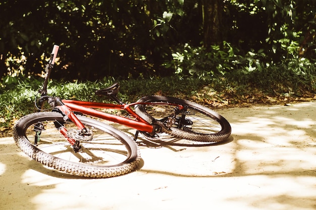 A mountain bike lying on the ground cycling and accidents copy space