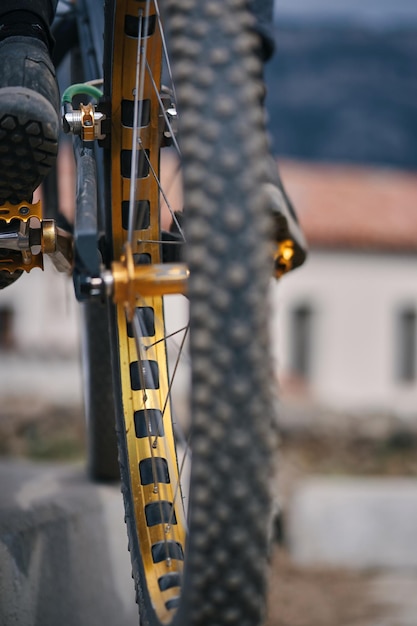 A mountain bike with a chain guard on the front wheel