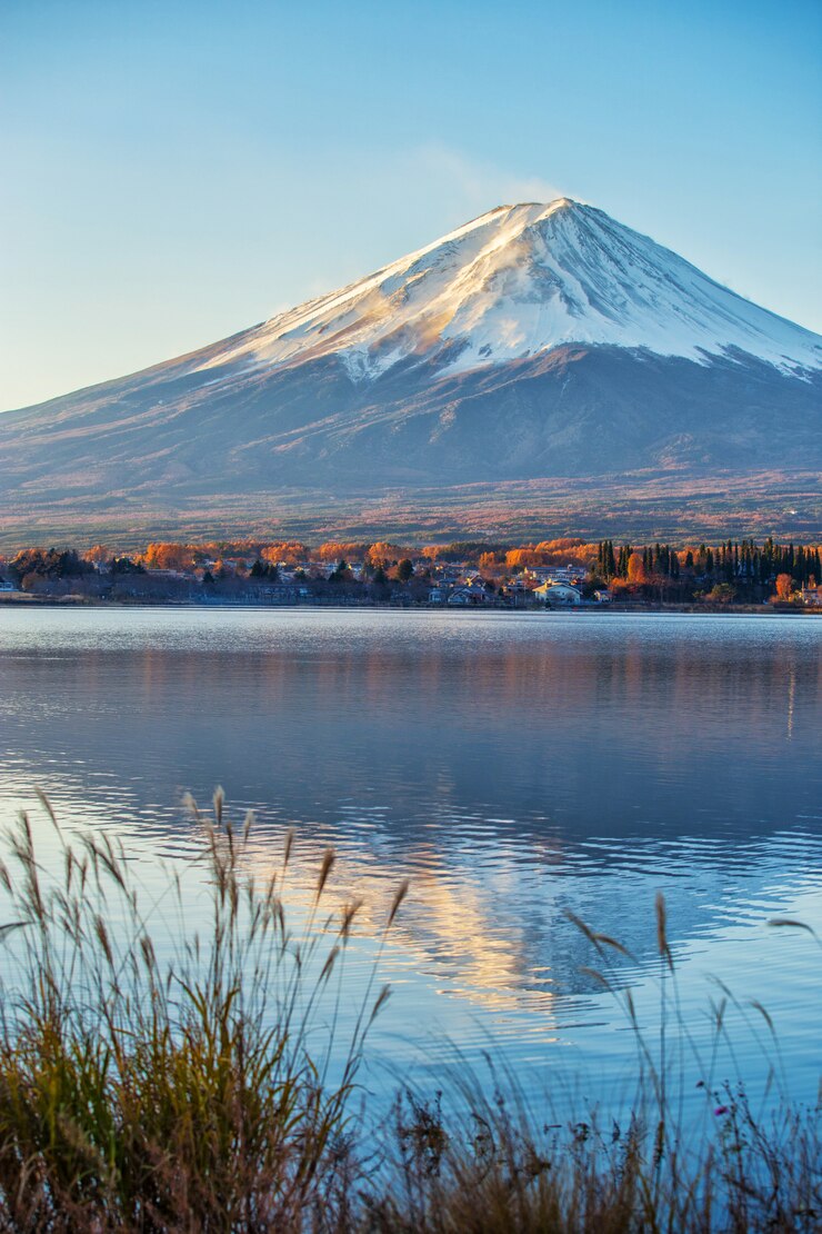 The mountain Fuji at dawn with peaceful lake reflection