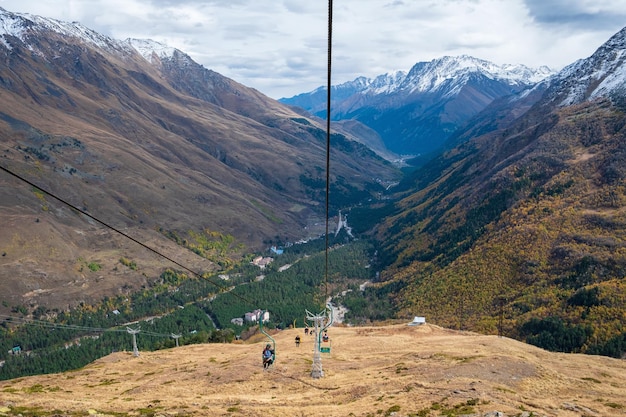 Mountain gorge with a singleseat cable car line for tourists skiers and climbers