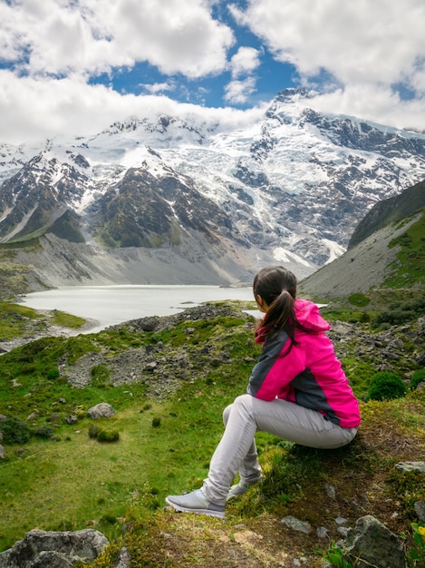 Mountain hiker traveling in wilderness landscape.