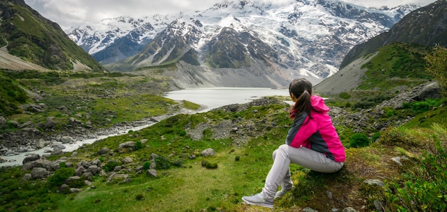 Mountain hiker traveling in wilderness landscape.