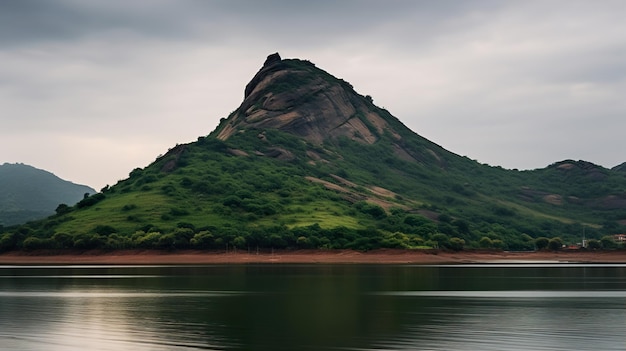 a mountain is reflected in the water with a lake in the foreground