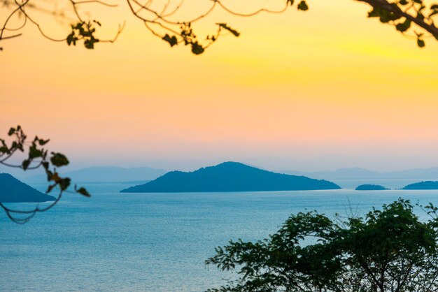 Mountain island on sunset sea