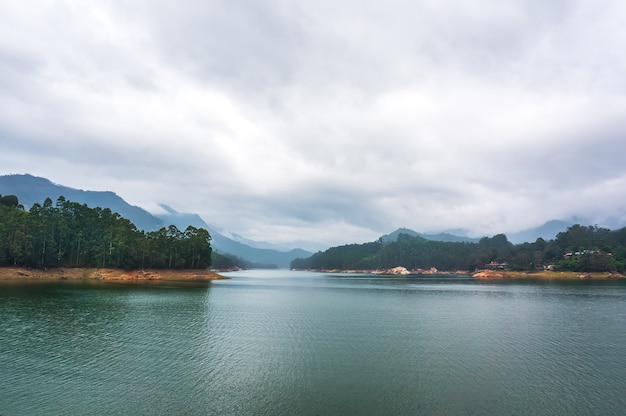 Mountain lake Kundale with overcast sky in Munnar, Kerala, India