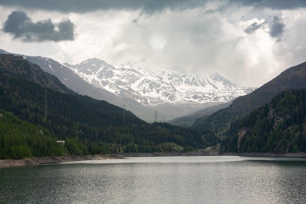 Mountain lake in Swiss alps in bad weather in summer