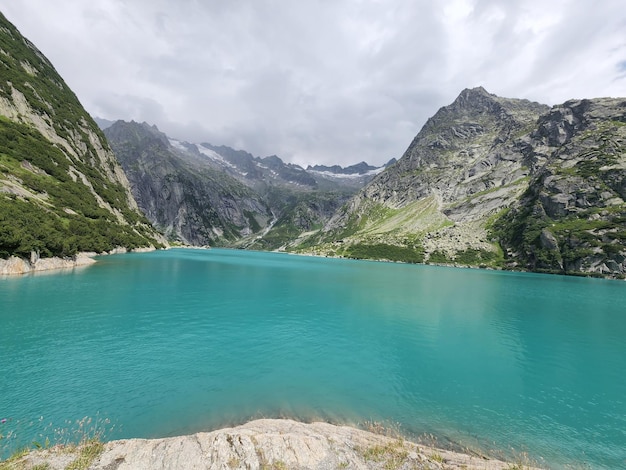 A mountain lake with blue water in guttannen switzerland