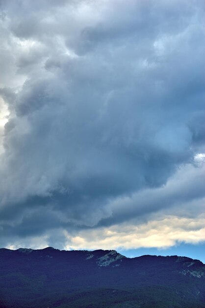 Mountain landscape against the background of the cloudy sky