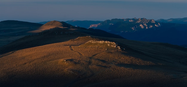 Mountain landscape, bucegi park at sunrise, carpathian mountains. sunrise light