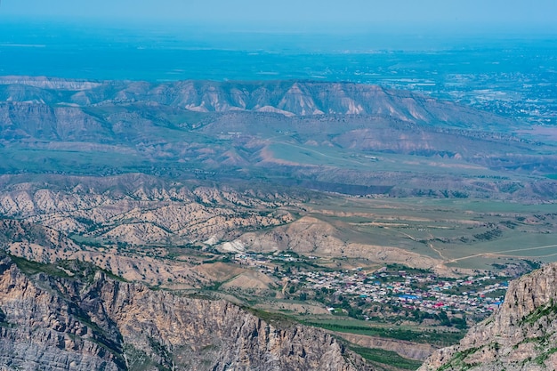 Mountain landscape in the Caucasus with a view of the valley of the Sulak River and the towns below on the plain