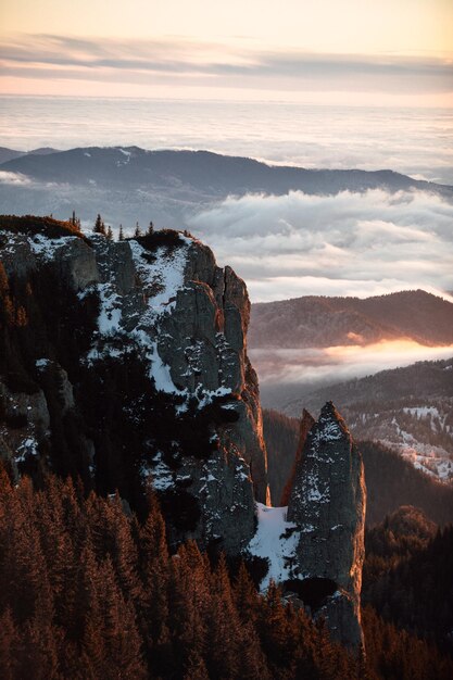 Mountain landscape seen from the ceahlau massif at sunset during winter season