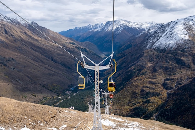 Mountain landscape with chairs of a singleseat cable car