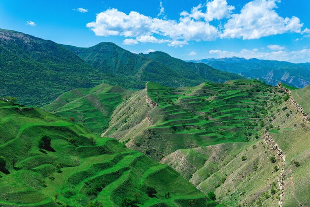 Mountain landscape with green agricultural terraces on the slopes