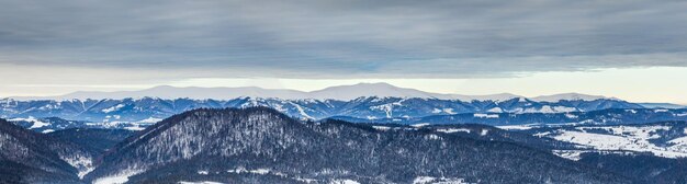 Mountain peak with snow blow by wind Winter landscape Cold day with snow