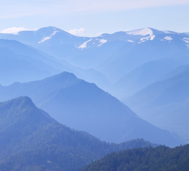 Mountain peaks in the morning haze, summer travel