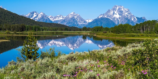 Mountain range are the backdrop for a beautiful reflection.