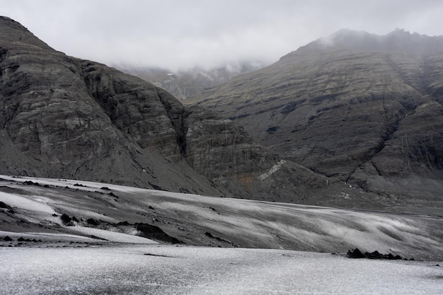 Mountain range shrouded in clouds