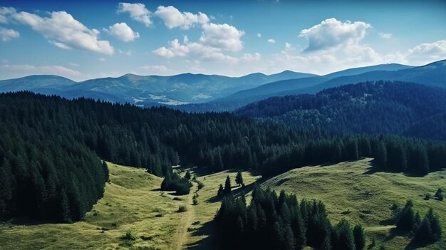 a mountain range with a meadow and mountains in the background