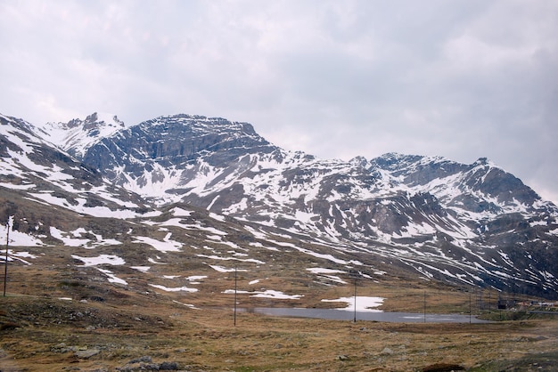 A mountain range with snow on the top and a mountain in the background.