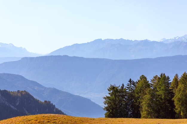 Mountain ranges of Seiser Alm in the morning fog Trentino Alto Adige South Tyrol Italy