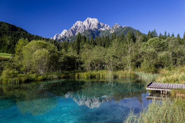 Mountain reflection in a small Lake in the north of Slovenia