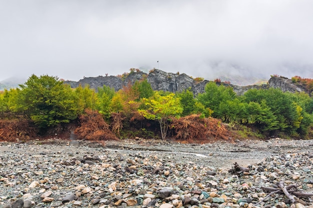 Mountain river bed in autumn season