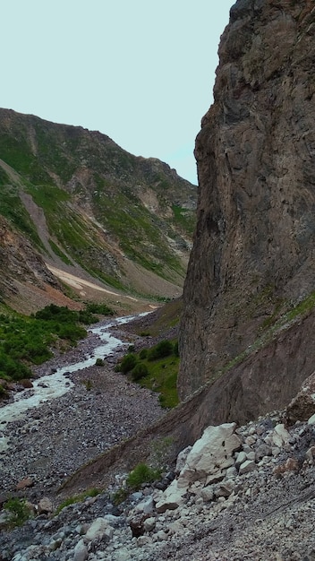 mountain river flows into the gorge