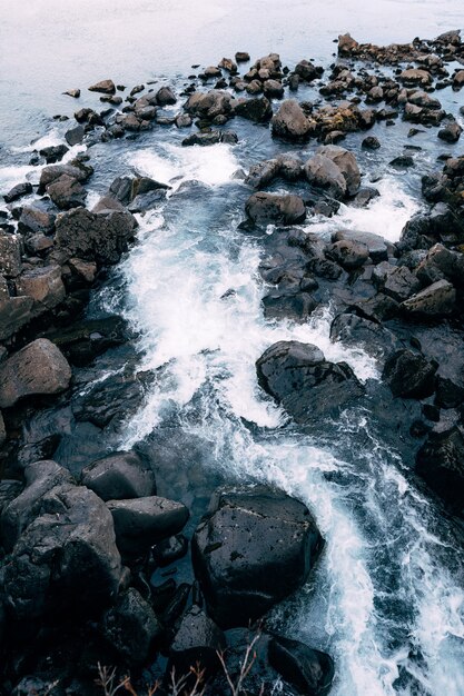 Mountain river from ehsaraurfoss falls in silfra fault tingwedlir valley