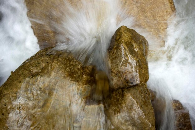 Mountain river with rapids the water quickly flows down the rocks