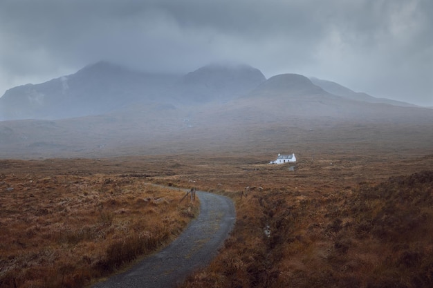 Mountain road leading to a remote hut at the foot of the mountain isle of skye scottish highlands sc...