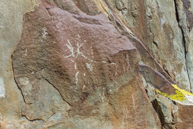 Mountain rock carvings. Altai. Close up.