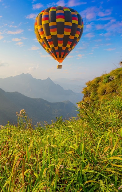 Mountain scenery with hot air balloons and beautiful sky