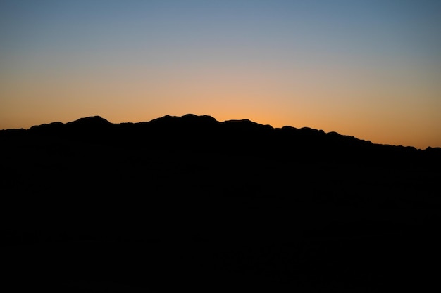 mountain silhouette in desert