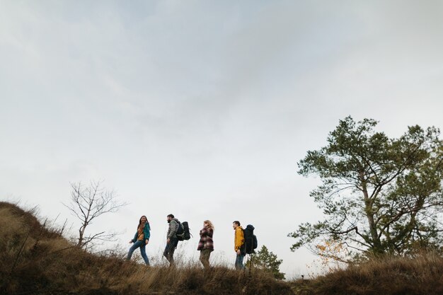 Mountain trip friends climb the mountain together