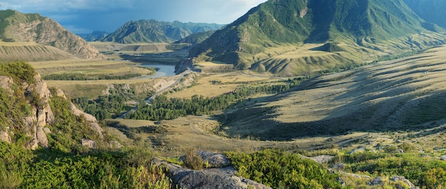 Mountain valley in contrasting evening light panoramic