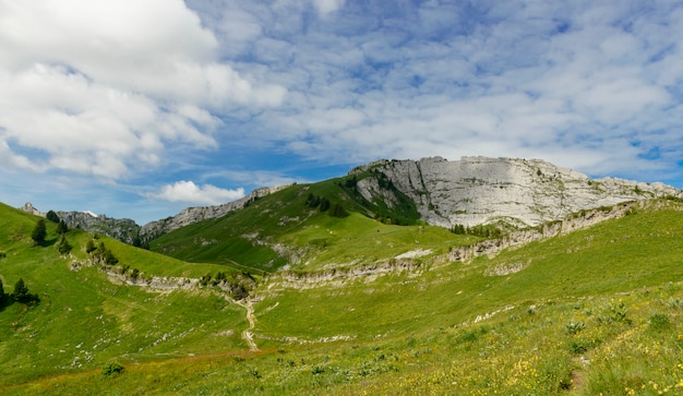 Mountain with a blue sky and small clouds