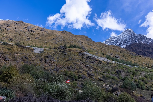 A mountain with a flag on it